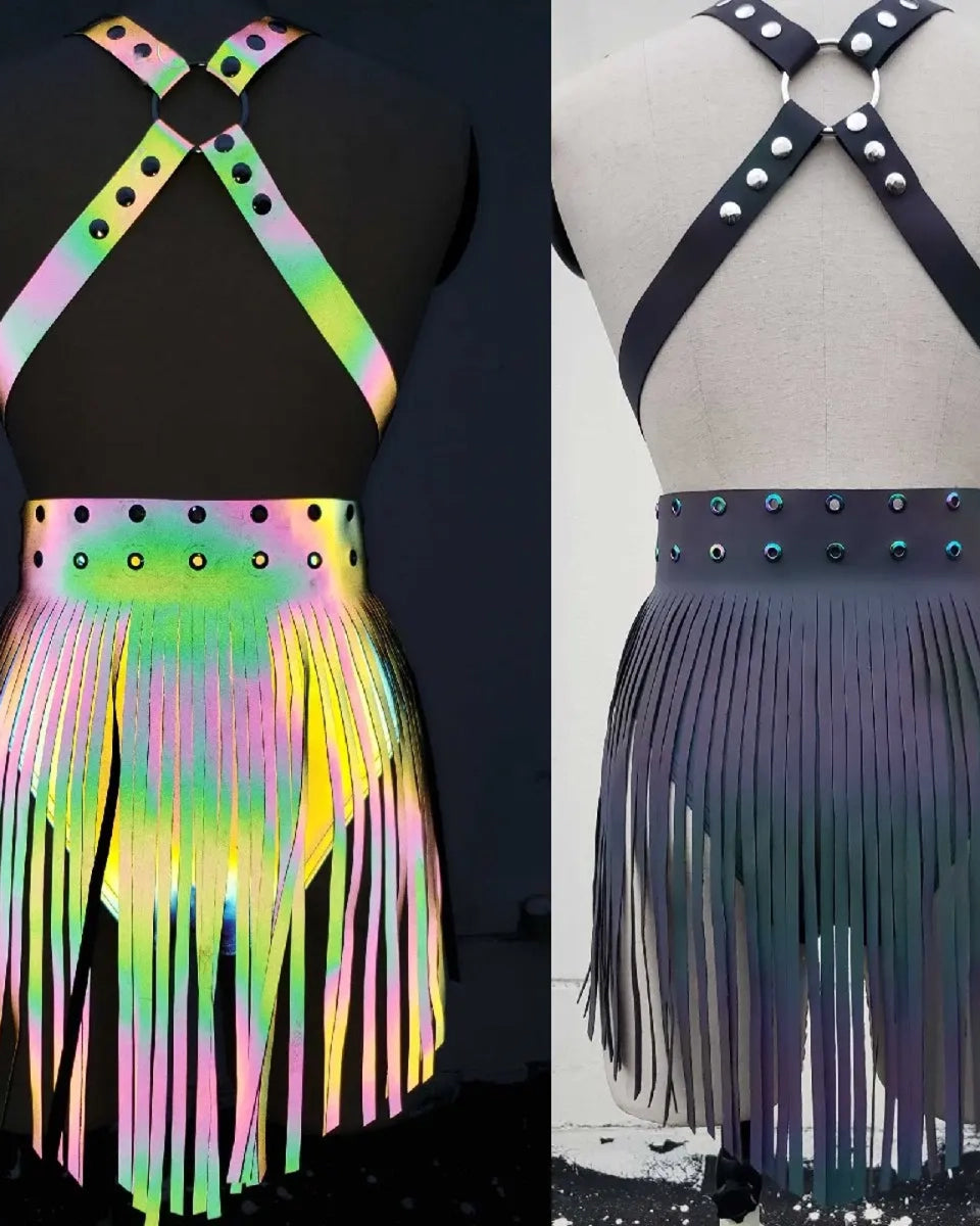 Two fringed skirts on mannequins, one colorful and one black.
