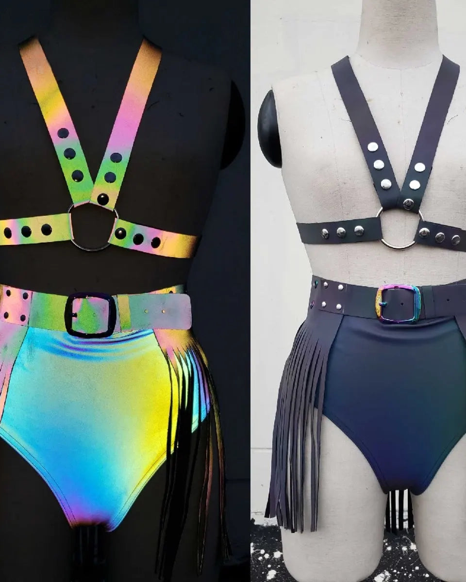 Two fringed skirts on mannequins one colorful and one black.