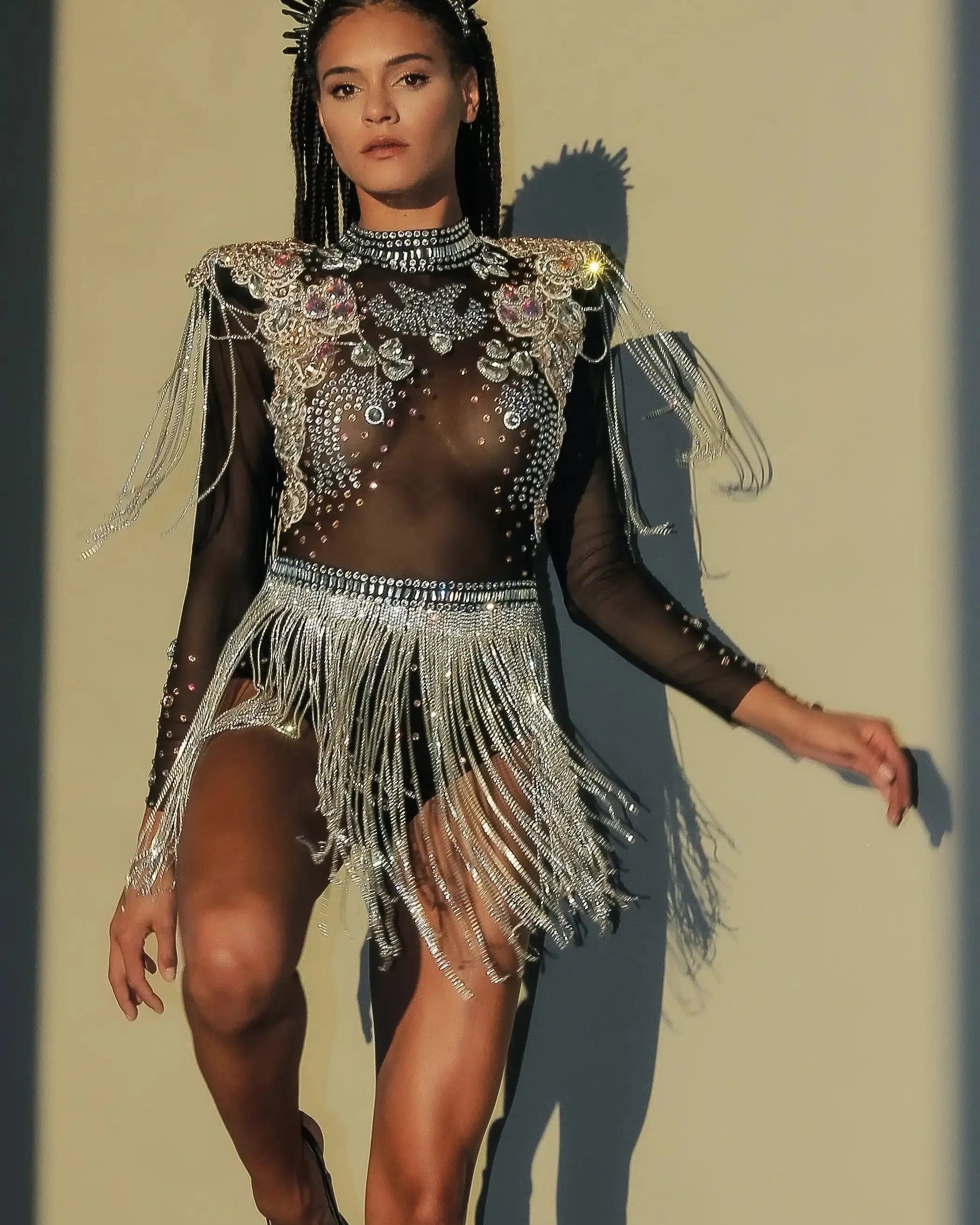 Stunning Rhinestone Tassel Festival Bodysuit featuring rhinestones, sequins, and flowing tassels.