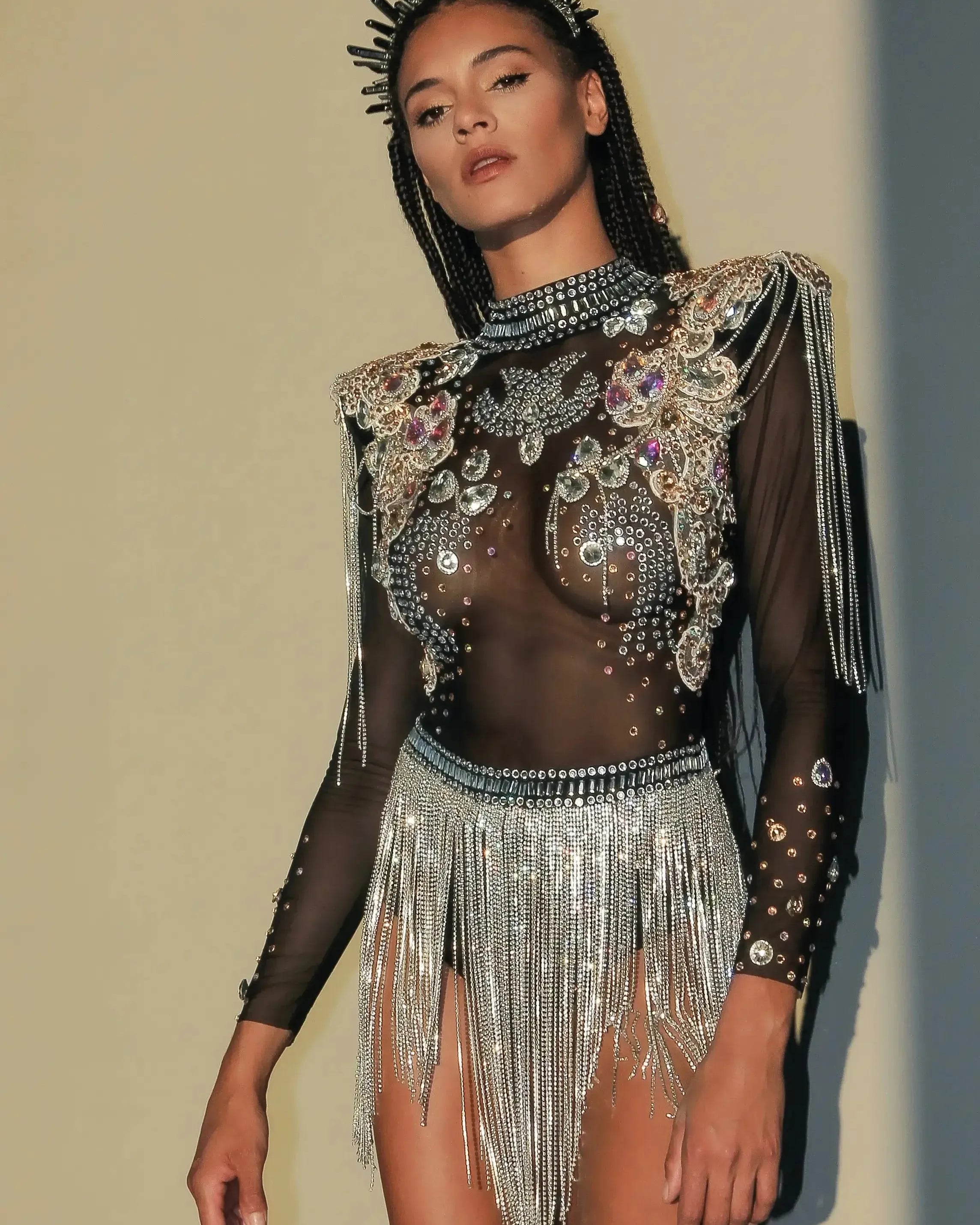 Rhinestone Tassel Festival Bodysuit with intricate rhinestone detailing and flowing tassels.