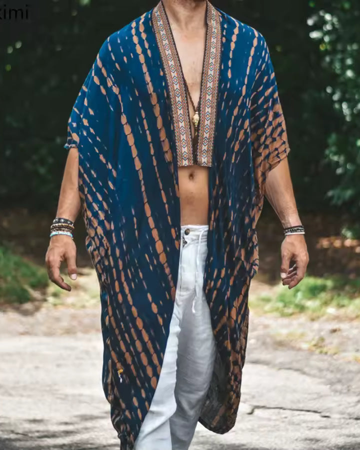 Kimono tribal unisexe Bali bleu en rayonne douce avec imprimé géométrique et détails de bordure complexes.