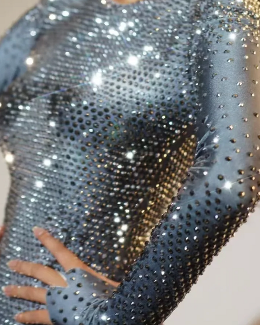 close-up of silver rhinestone long-sleeve bodysuit with sparkling rhinestones