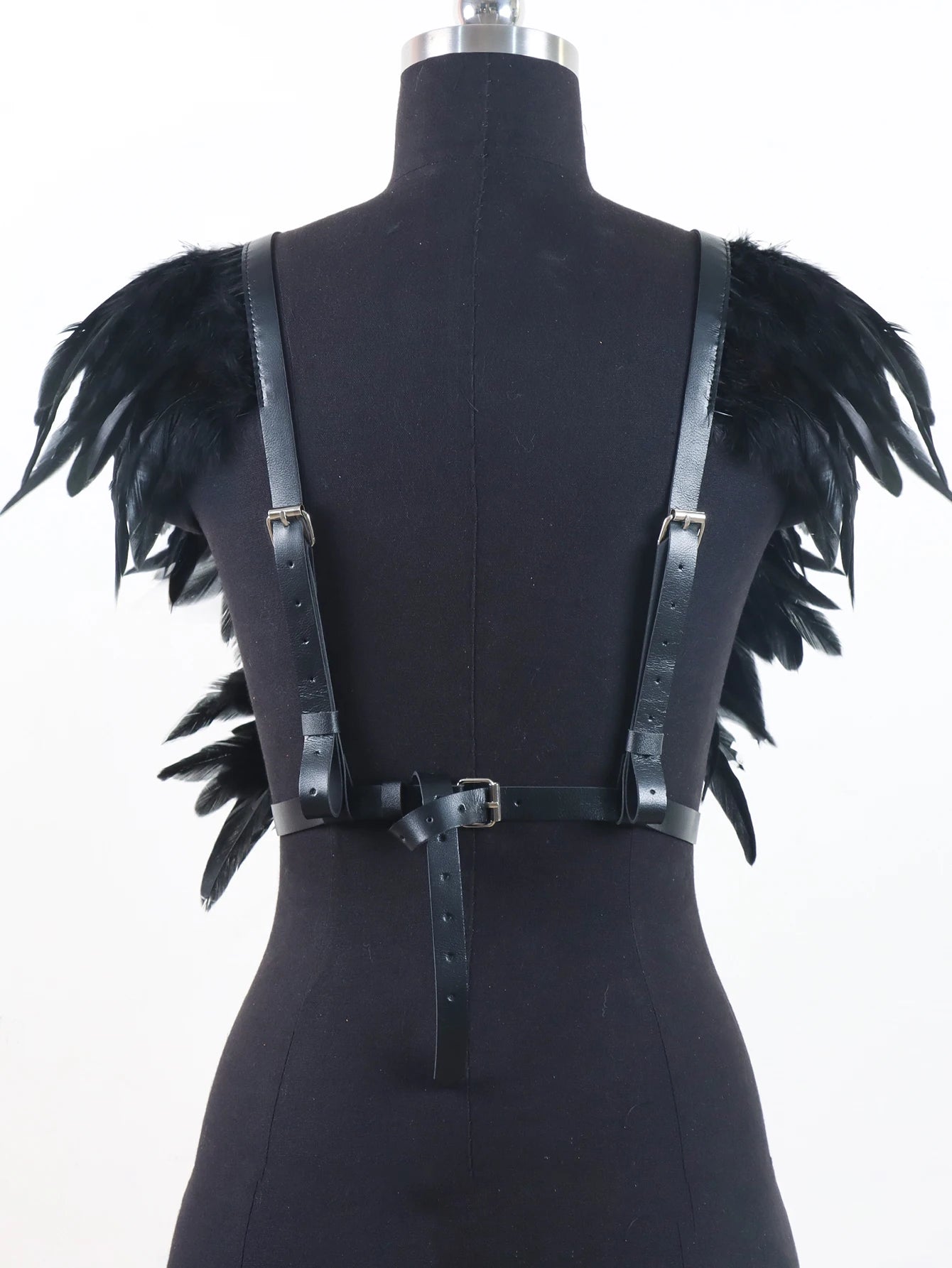 Black Feather Top featuring stylish black feather accents and adjustable straps for a perfect fit.