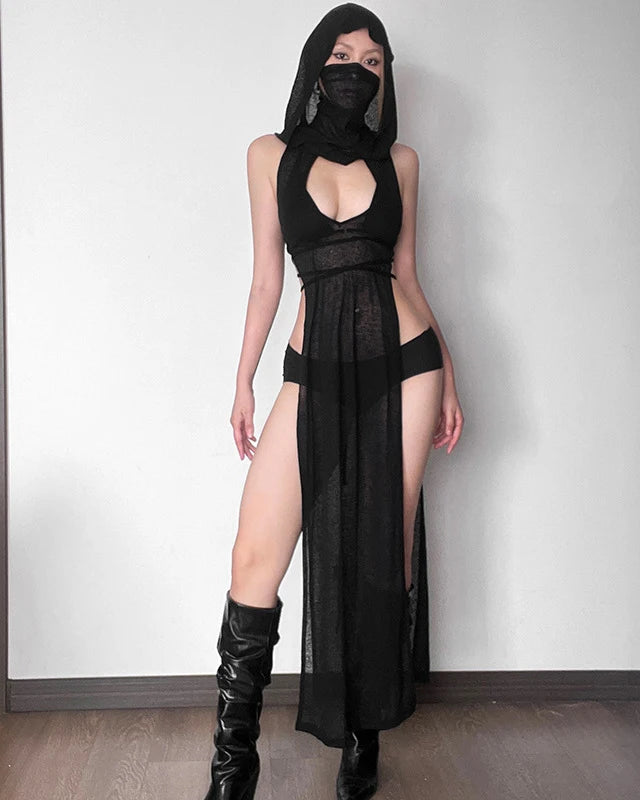 Model wearing Black Knitted Hooded Long Dress with a bold slit and stylish boots.
