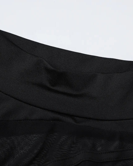 Black Long-Sleeve See-Through Bodysuit detailing the smooth waistband and sheer fabric texture.