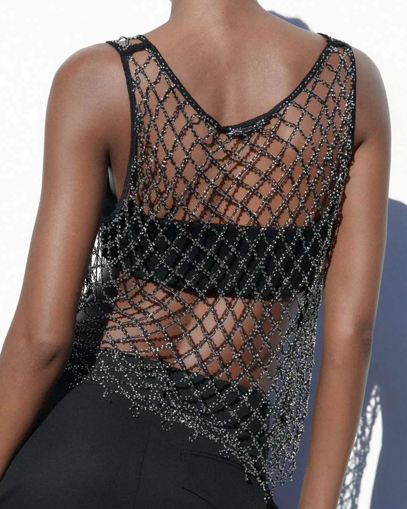 Black See Through Mesh Tank Top featuring rhinestone detailing, perfect for festival fashion.