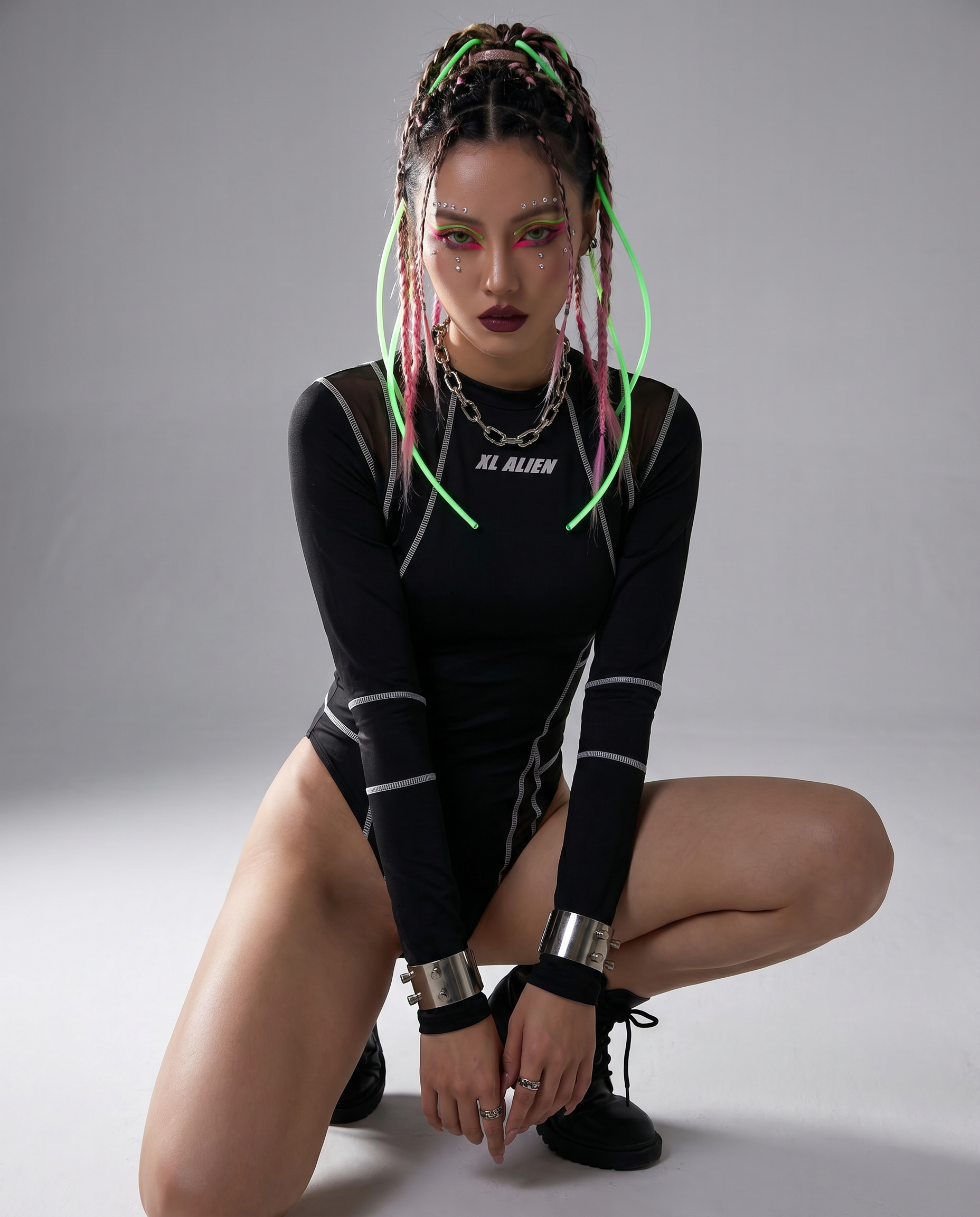 Black long-sleeve rave bodysuit with white stitching, mesh details, and "XL ALIEN" logo.
