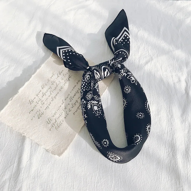 Satin Bandana in black with white patterns, perfect for daily wear and versatile festival styles.