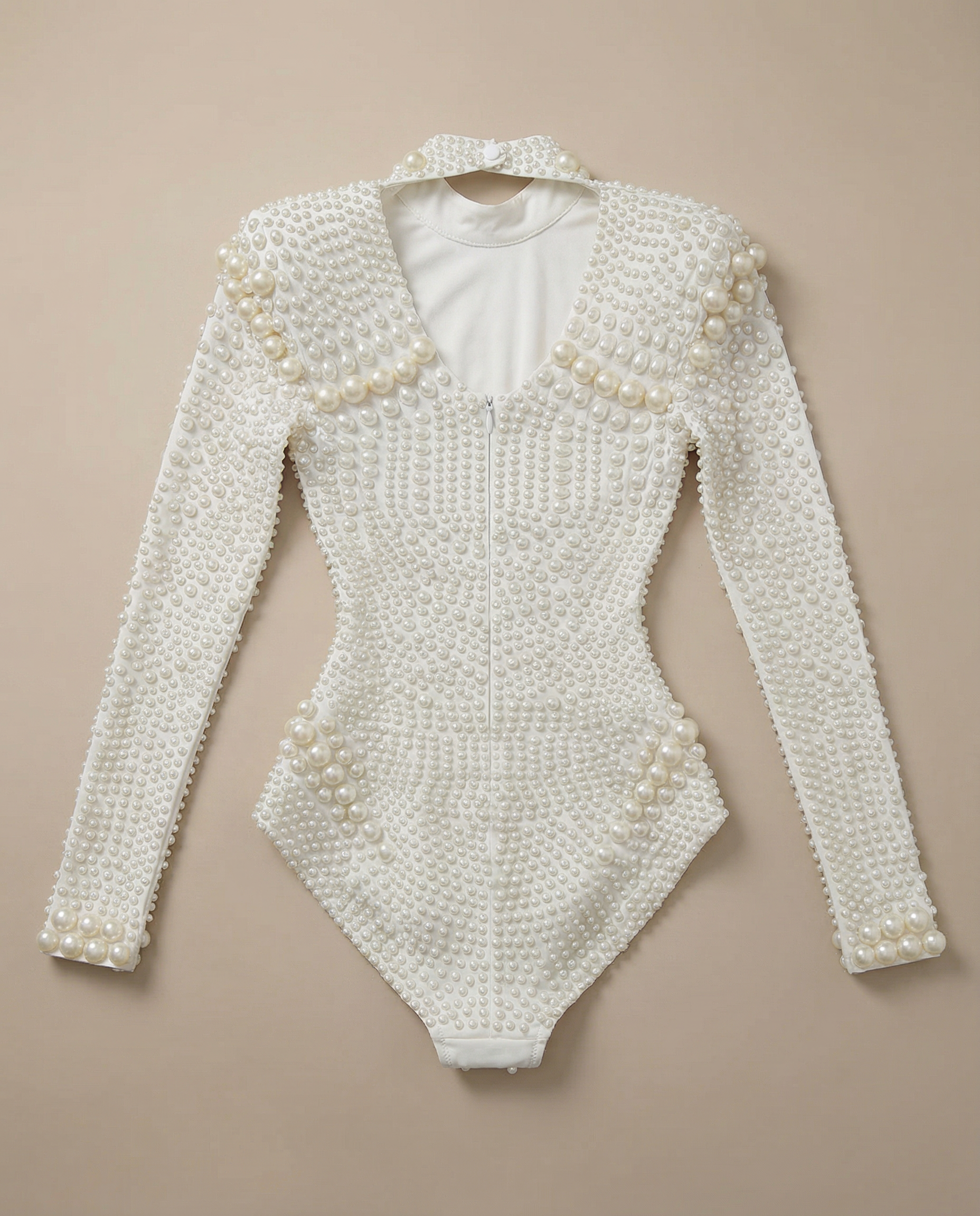 White pearl-embellished long sleeve bodysuit with a V-neck and figure-hugging stretch fit.