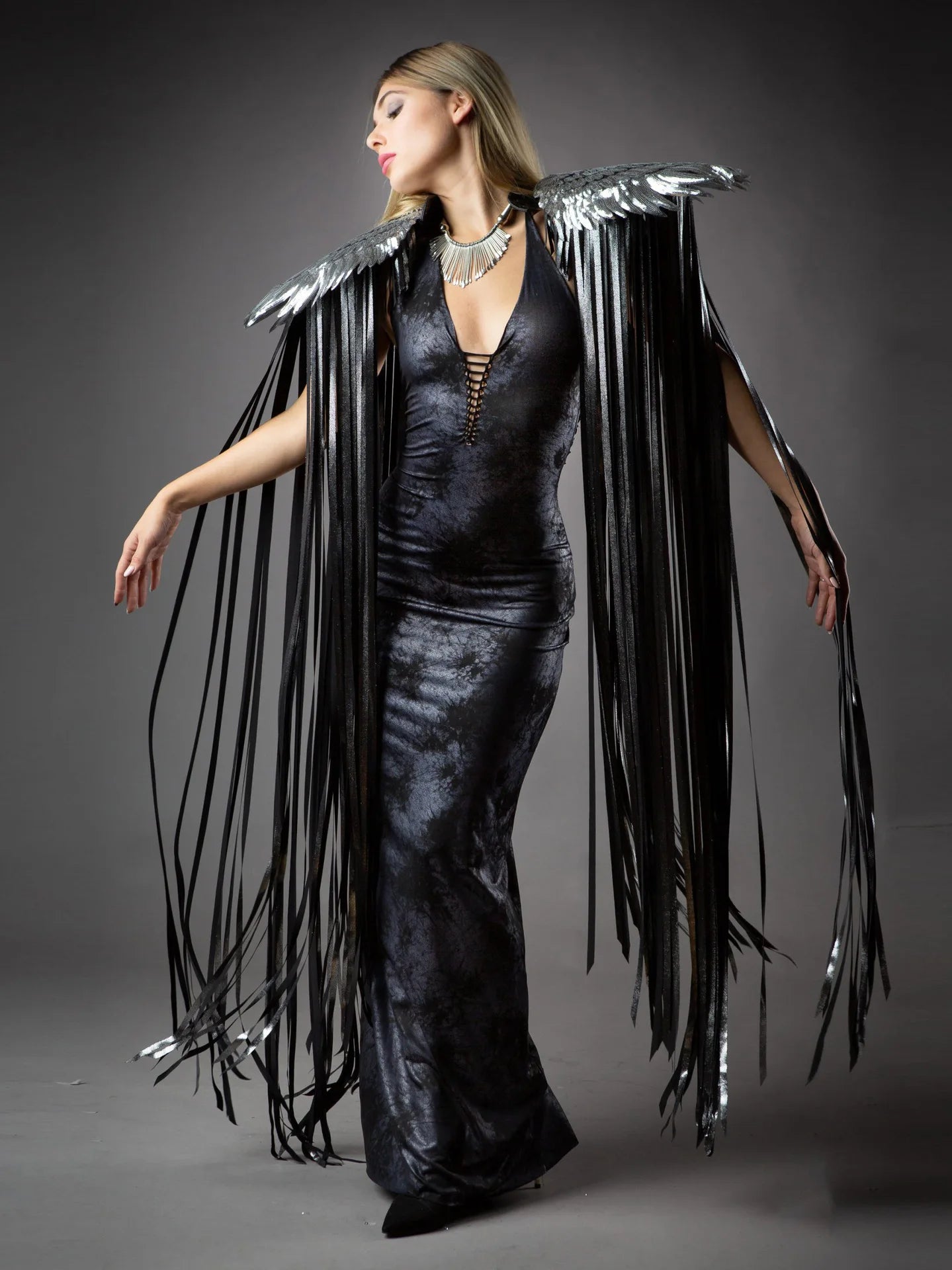 Cosplay Long Tassel Wings showcased, featuring flowing black tassels and a stylish dress.