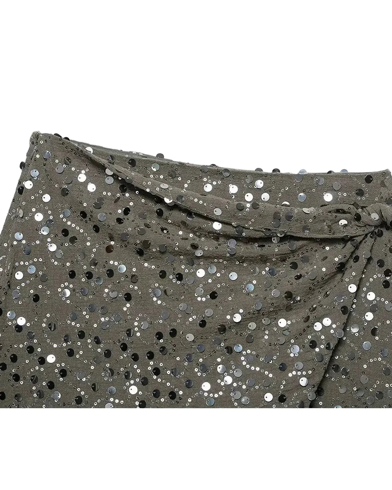 Green sequin crossover mini skirt with a stretch spandex base and all-over shimmer.