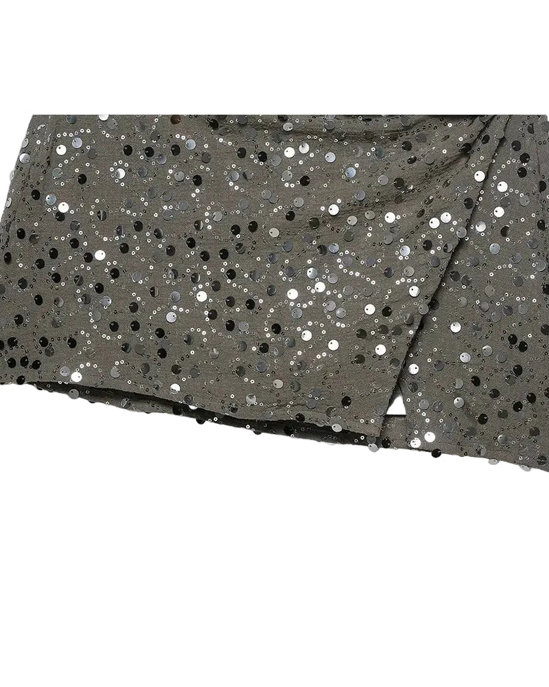 Green sequin crossover mini skirt with a stretch spandex base and all-over shimmer.