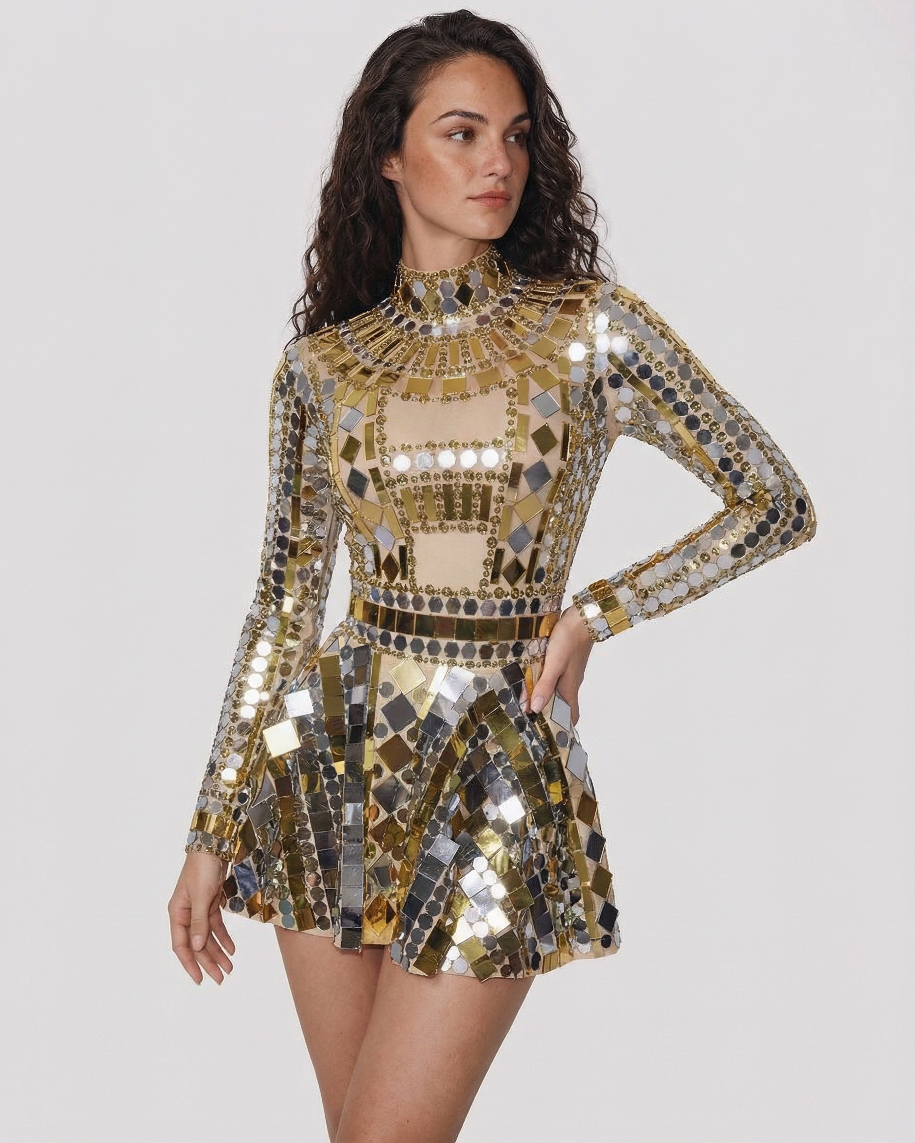 Gold sequin party dress with long sleeves, high neck, and mirrored geometric embellishments.