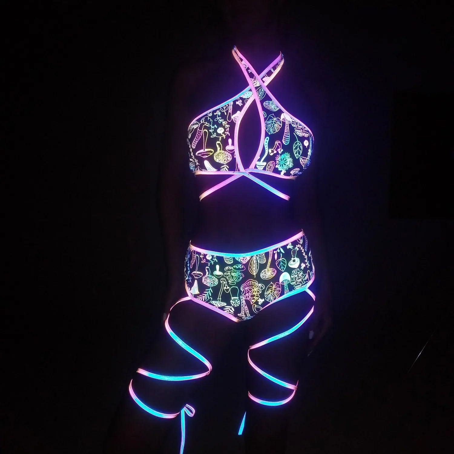 holographic reflective bikini set close-up vibrant neon design glowing straps in dark