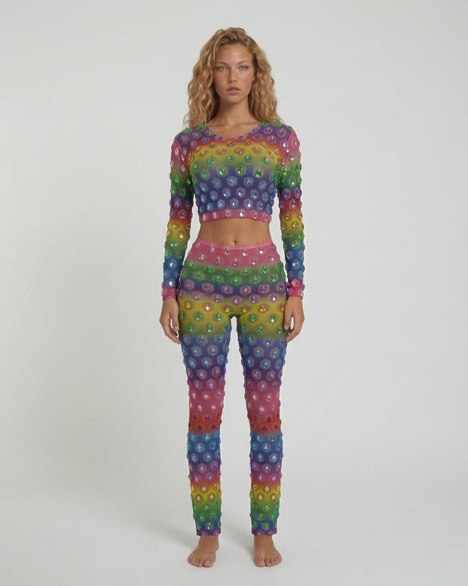 Multicolor rhinestone mesh crop top and fitted leggings set with a rainbow gradient.