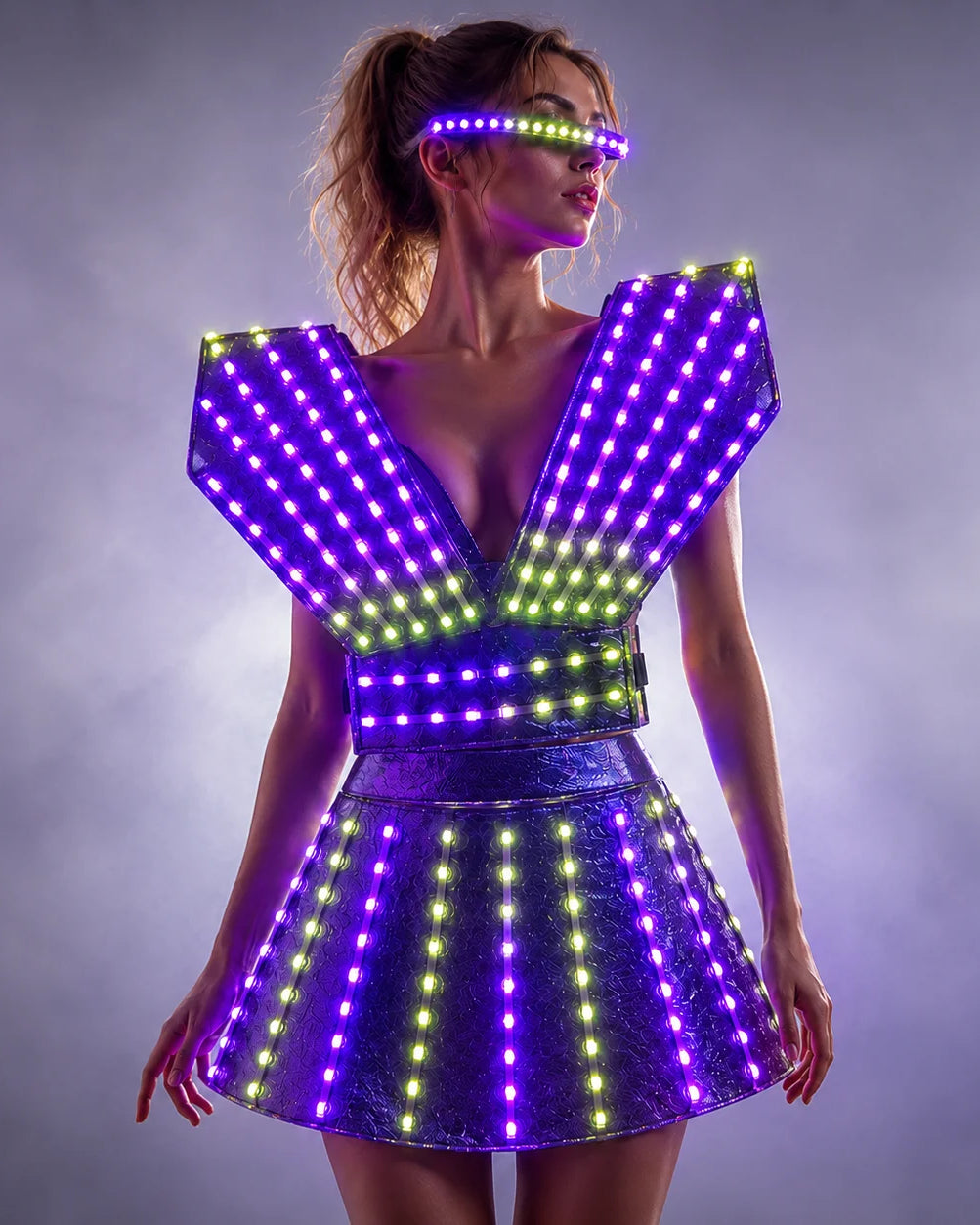 Futuristic LED dress with glowing purple and yellow lights, structured shoulders, and matching light-up visor for performers.