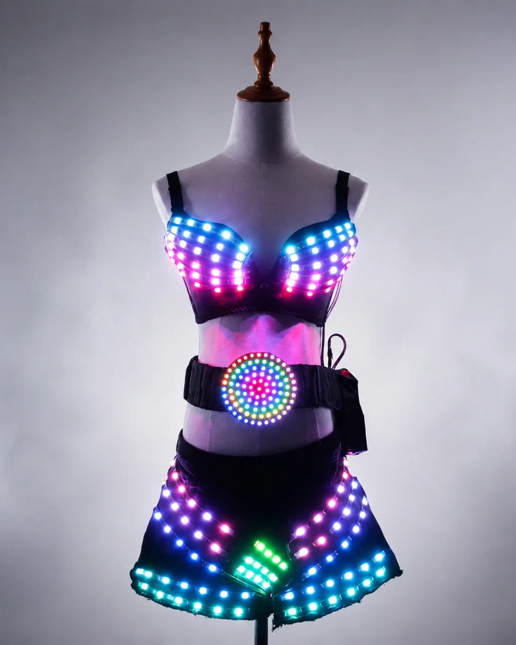 Black LED light-up rave set featuring a remote-controlled bra, belt, and shorts with multi-color glowing lights on a mannequin.