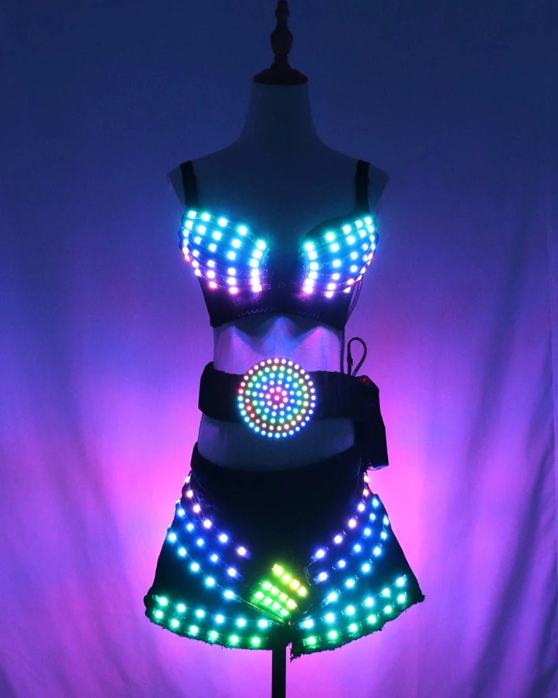 Three-piece LED light-up rave set featuring a glowing bra, belt, and shorts in black stretch fabric with remote control.