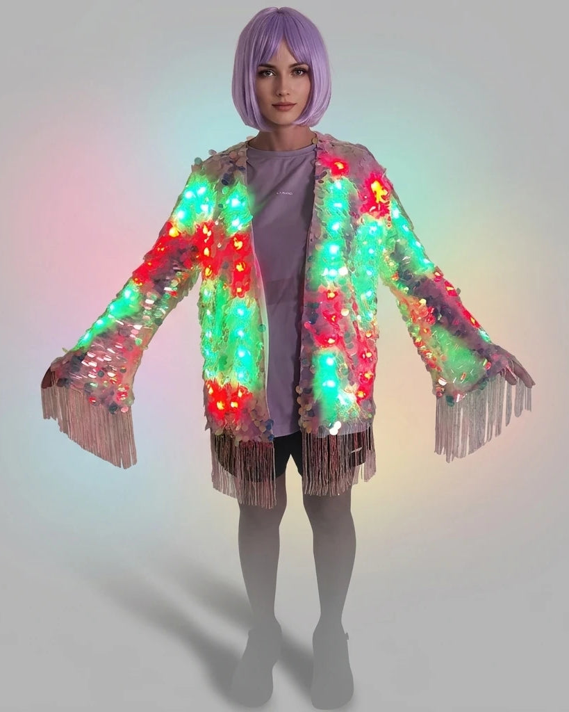 Model wearing a sequin fringe jacket with integrated LED lights in a vibrant, multi-colored display.