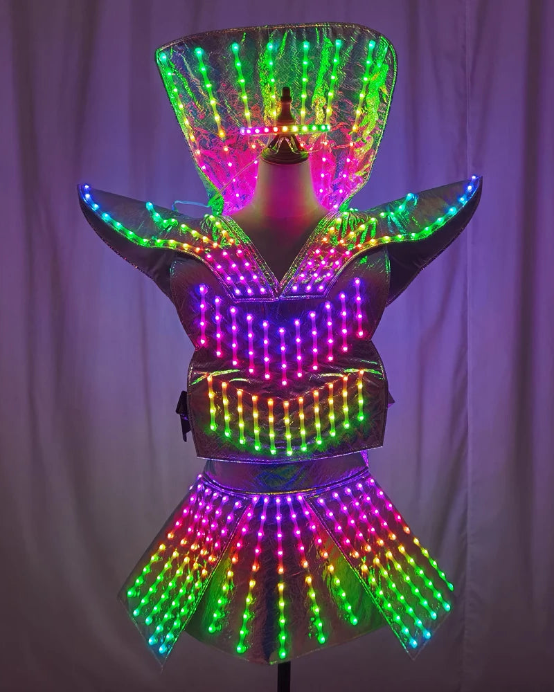 Futuristic LED shoulder armor dress with a metallic finish, featuring remote-controlled multicolored lights and a mini skirt.