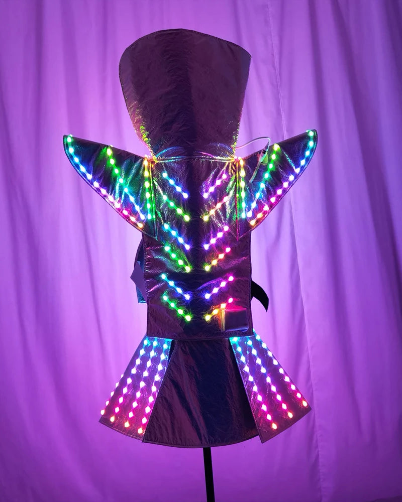Futuristic LED shoulder armor dress with remote-controlled multicolor lights and structured metallic fabric silhouette.