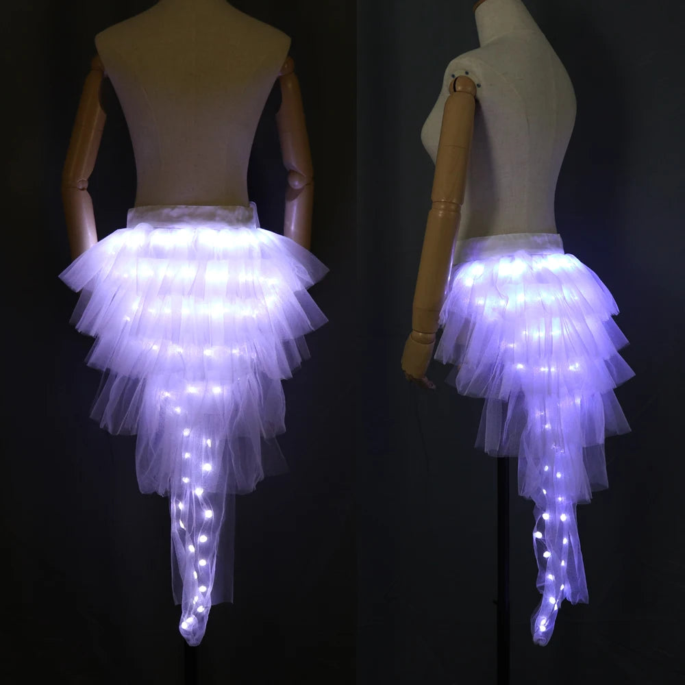White layered tulle tutu skirt with integrated glowing LED lights on a mannequin, shown from back and side angles.