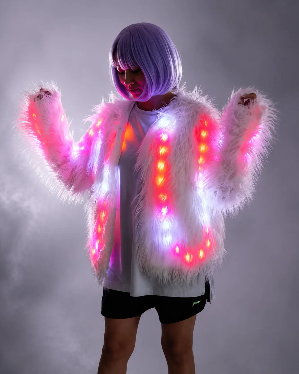 Plush white faux fur jacket featuring integrated remote-controlled LED lights glowing in vibrant pink and white.