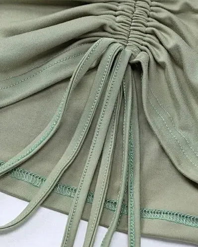 Detail of Long Sleeve Crop Top with Mini Skirt