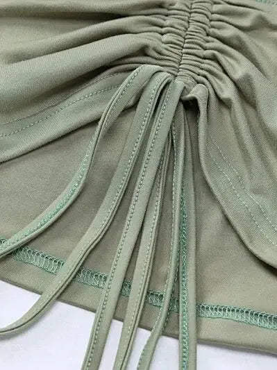 Detail of Long Sleeve Crop Top with Mini Skirt