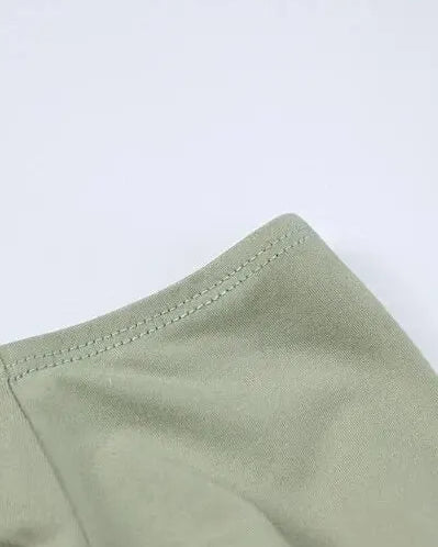 Detail of green Long Sleeve Crop Top with Mini Skirt