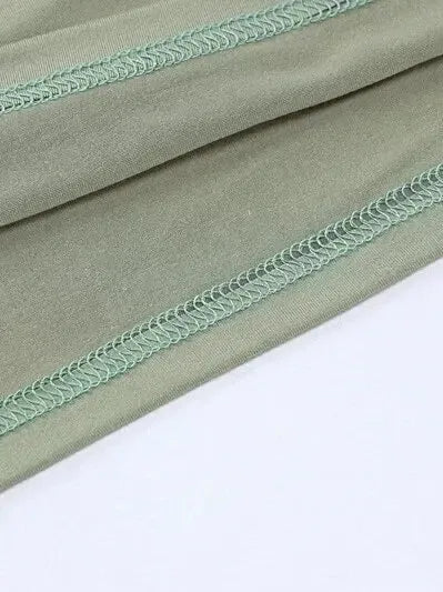 Detail of fabric of Long Sleeve Crop Top with Mini Skirt