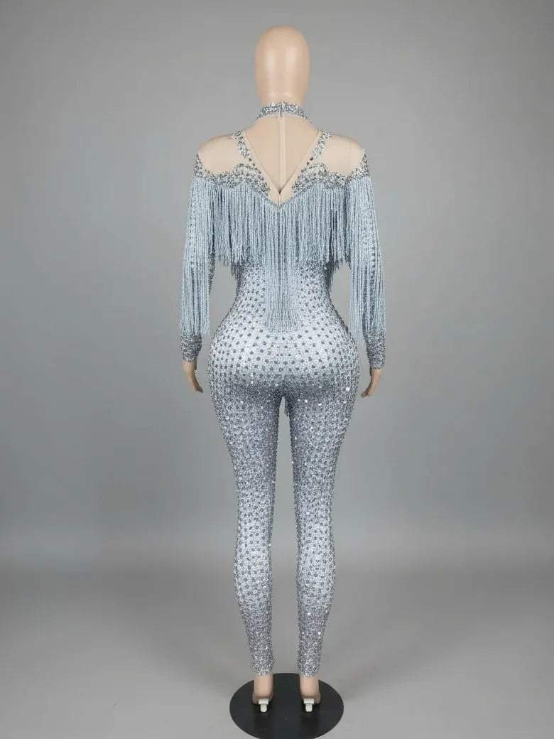 Luna Rhinestone Fringe Jumpsuit: Full-length, nude spandex base with all-over rhinestones and a dramatic white fringe cape.
