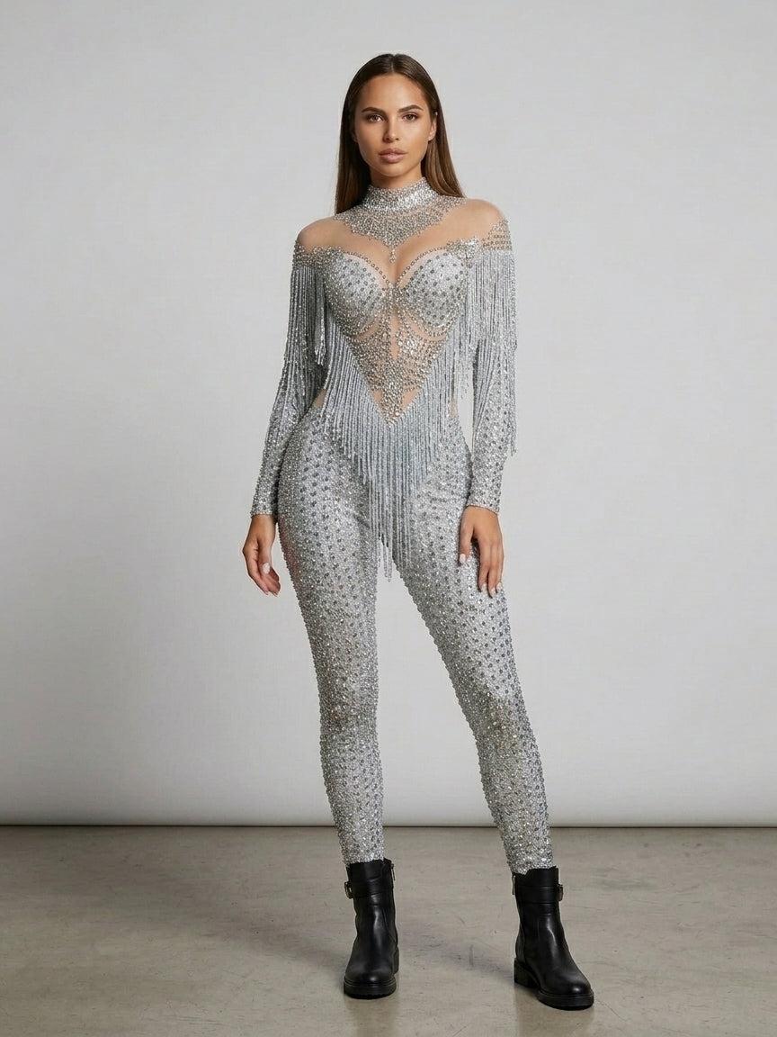 Luna Rhinestone Fringe Jumpsuit: full-length, silver, with sheer mesh high-neck and dramatic fringe cape.