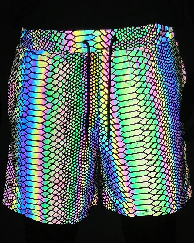 Men's reflective festival shorts with a vibrant, iridescent snakeskin pattern and black drawstring.