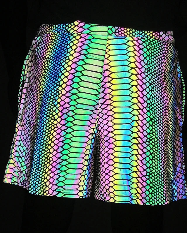 Men's reflective festival shorts with a vibrant, iridescent snakeskin pattern on a dark background.