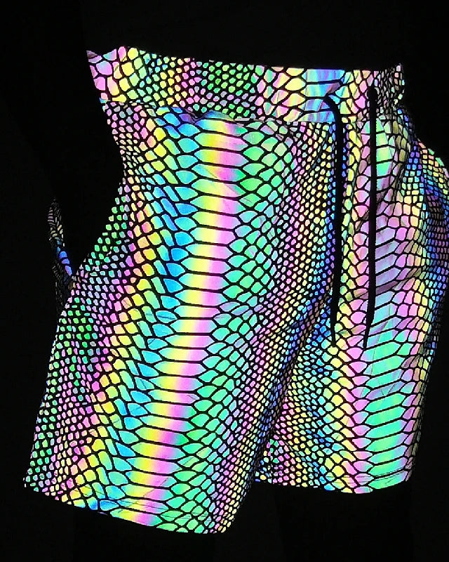 Men's reflective festival shorts with a vibrant, iridescent snakeskin pattern and drawstring waist.