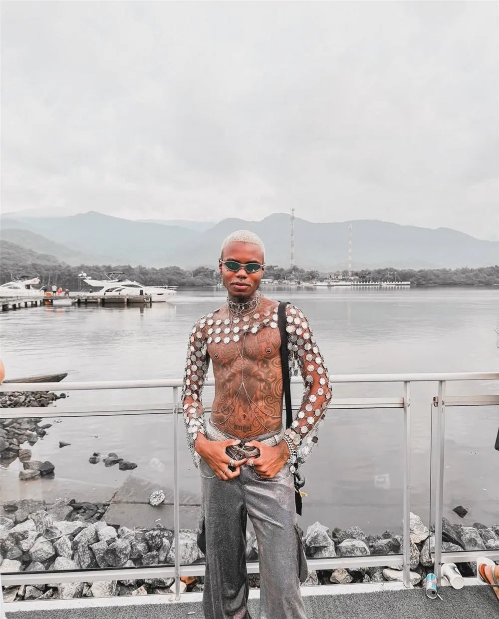 metal chain disc crop top close-up of model showcasing stunning armor-inspired design at waterfront