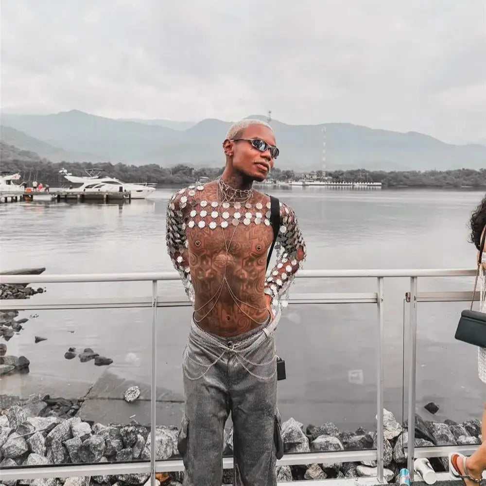 metal chain disc crop top side-profile view with metallic discs by water, edgy fashion statement