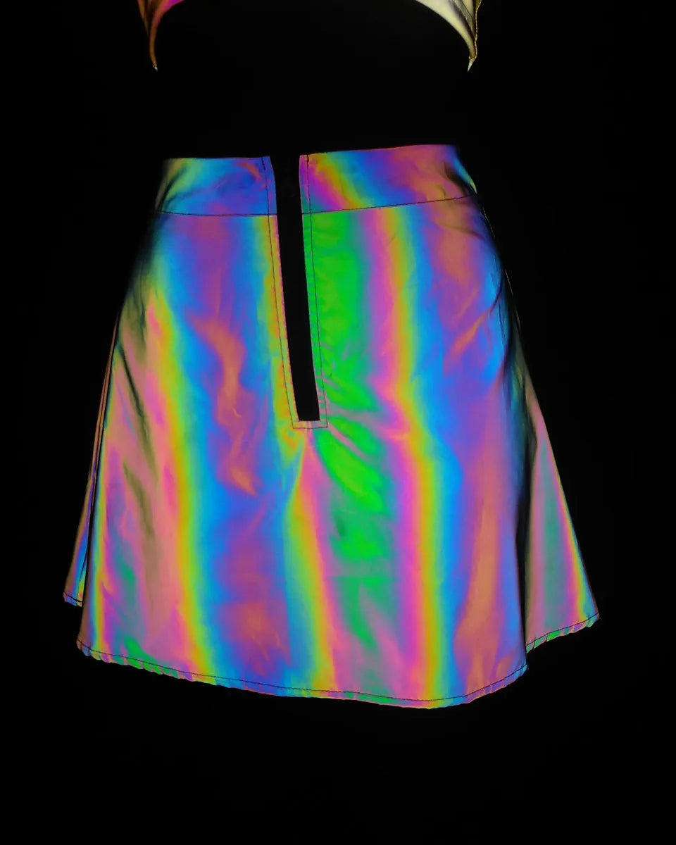 Multicolor reflective polyester mini skirt with a front zipper, part of a two-piece set.