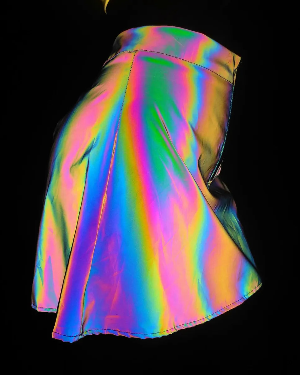 Multicolor reflective polyester two-piece set, flaring into rainbow brilliance under light.