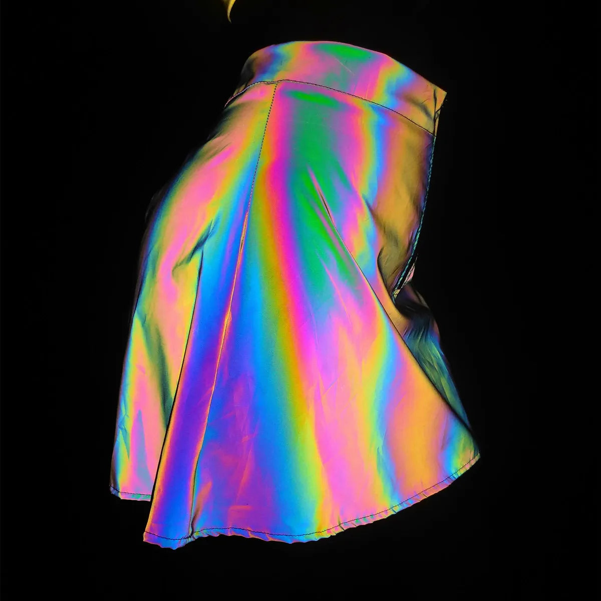 Multicolor reflective polyester two-piece set, flaring into rainbow brilliance under light.