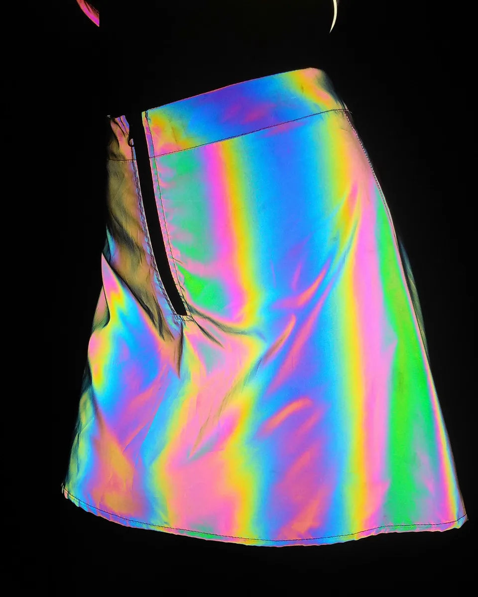 Multicolor reflective polyester mini skirt with a black zipper, showcasing its rainbow brilliance.
