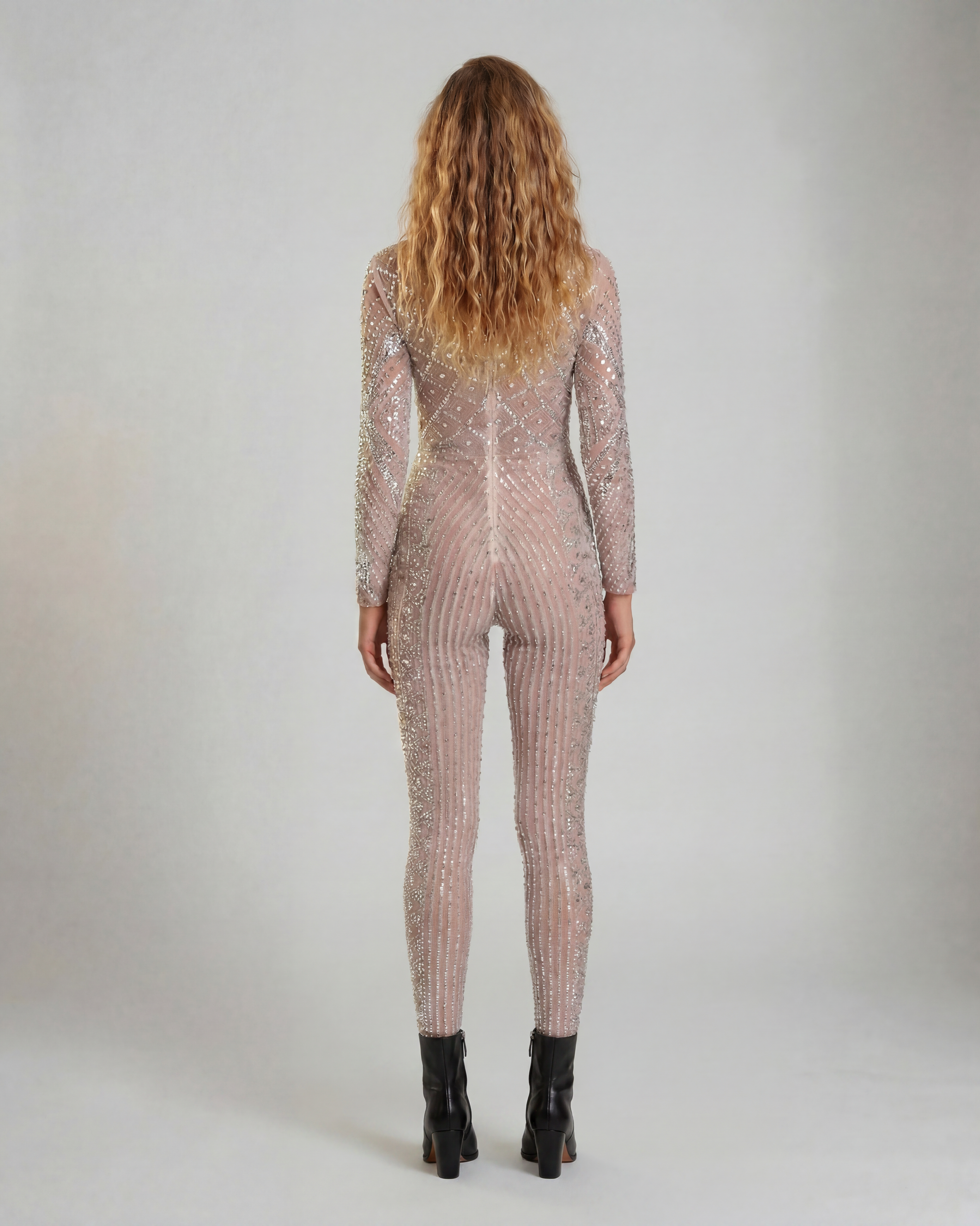 Nova Silver Rhinestone Jumpsuit, a fitted, long-sleeve, full-coverage garment with hand-glued rhinestones.