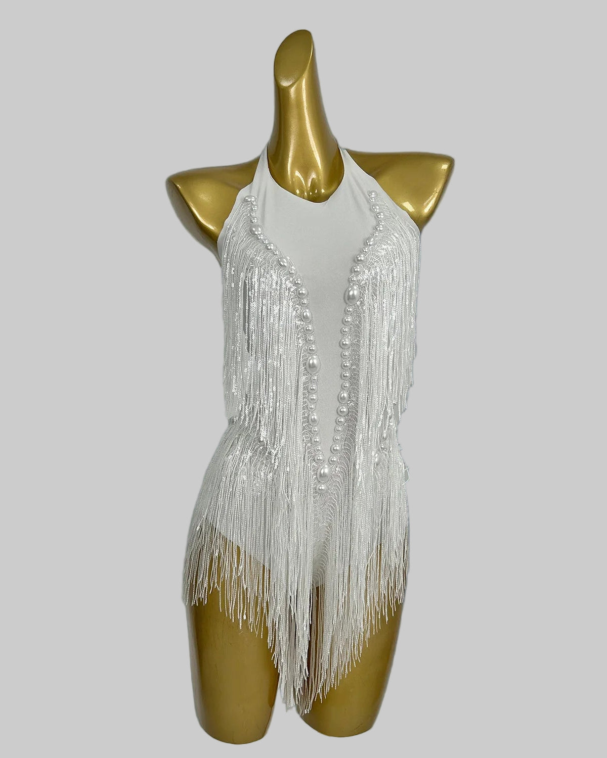 close-up of white tassel pearl sequin fringe bodysuit with shimmering tassels and pearls