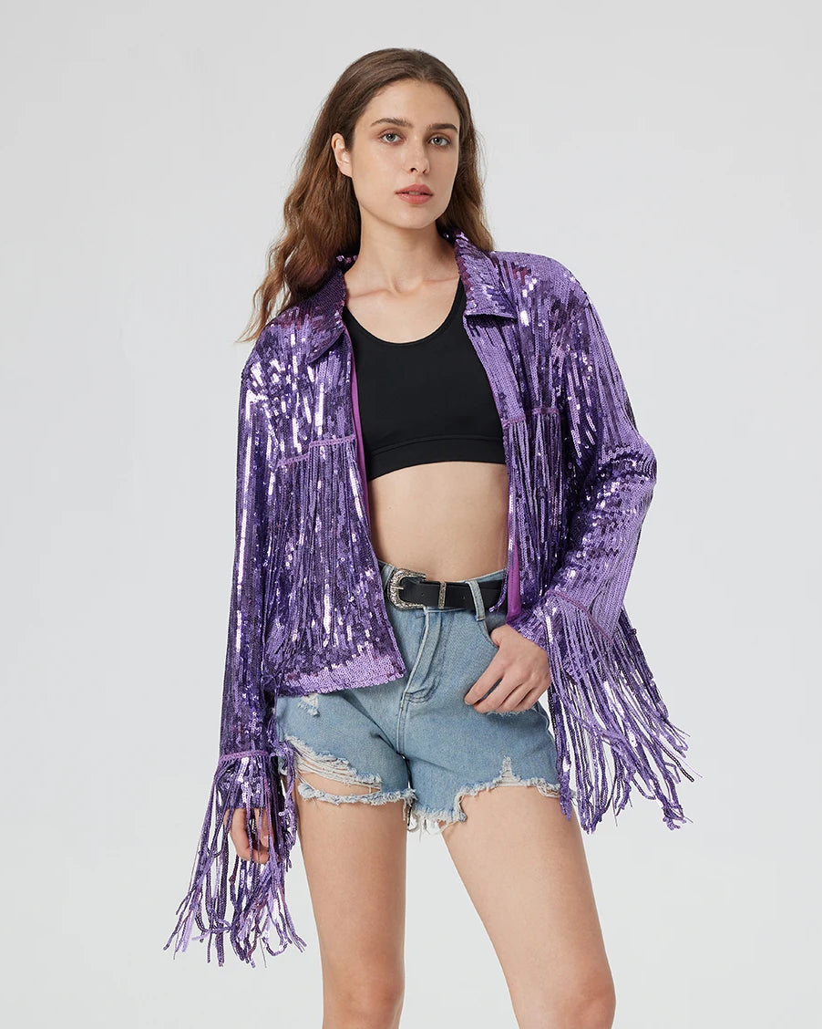 Purple metallic sequin jacket with long fringe trim, worn over a black crop top and denim shorts.