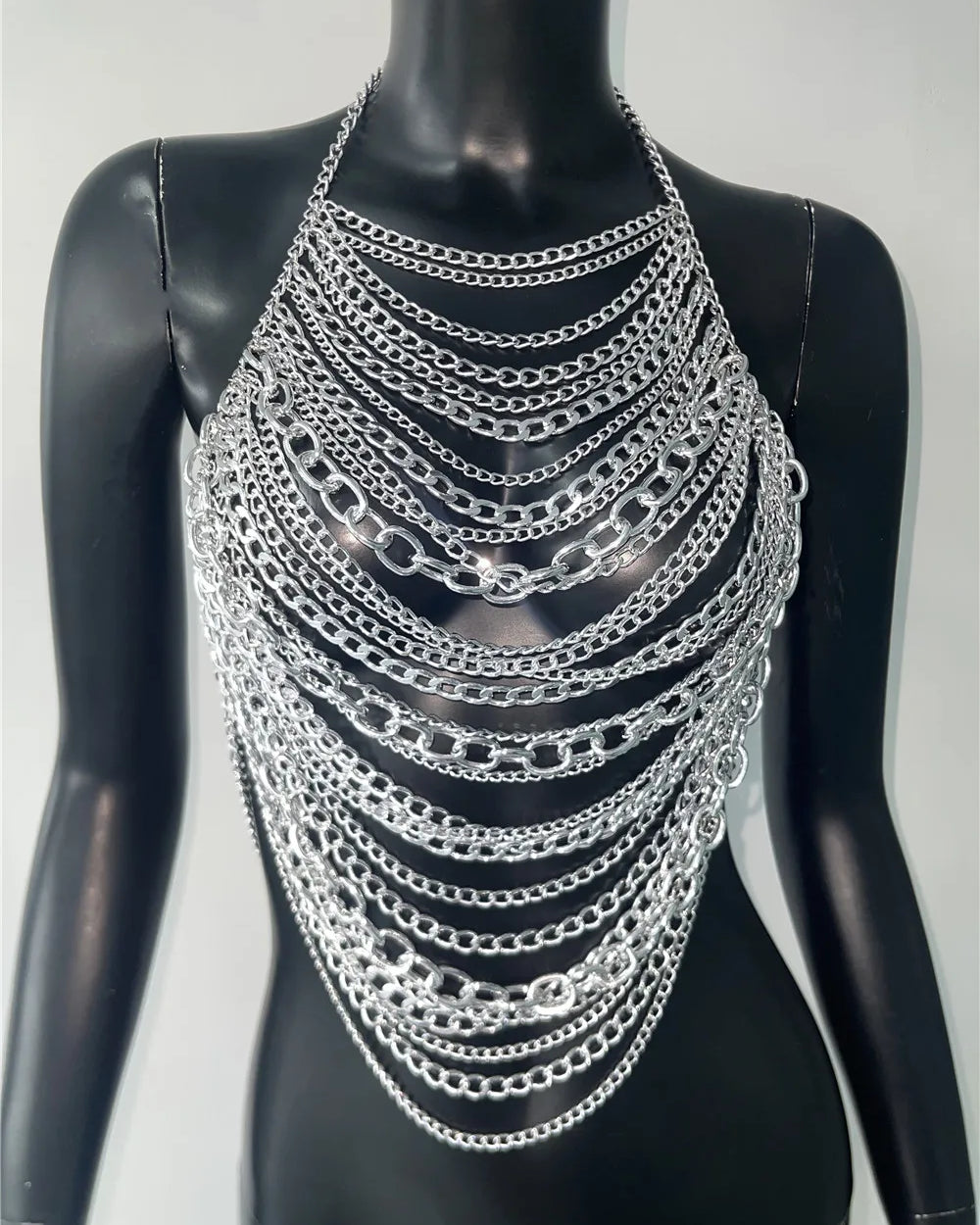 Dazzling Sequin Metal Chest with multiple layered silver chains for bold festival style.