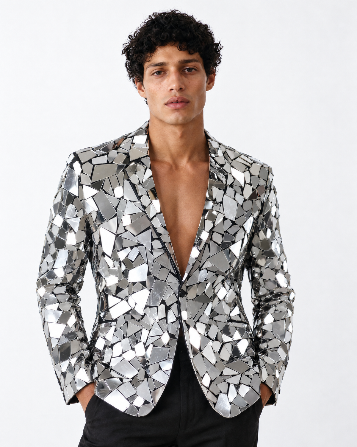 Tailored silver blazer featuring structured geometric mirror panels on a cotton-polyester base for a high-fashion look.