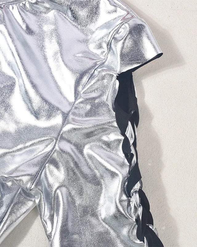 Close-up of the shiny Silver Metallic Crop Top fabric showcasing its sleek texture and stylish design.