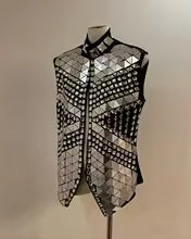 Silver mirror rhinestone men's vest with geometric panels and hand-glued rhinestones on a black polyester base.