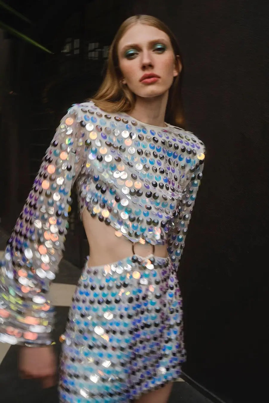 Silver Sequin Hollow-Out Mini Party Dress with shimmering sequins and edgy cut-out design.